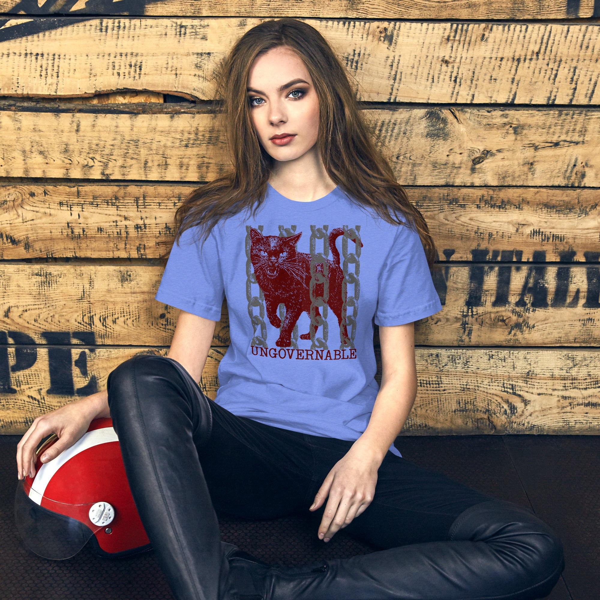 Product mockupSnarling cat breaking through chains with UNGOVERNABLE text, dithered halftone red on cream, Artificial Perdition apparel