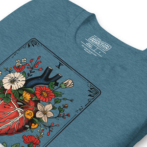 Tarot card illustration numbered X with an anatomical heart in bloom surrounded by wildflowers and vines, Amor Fati, Artificial Perdition apparel
