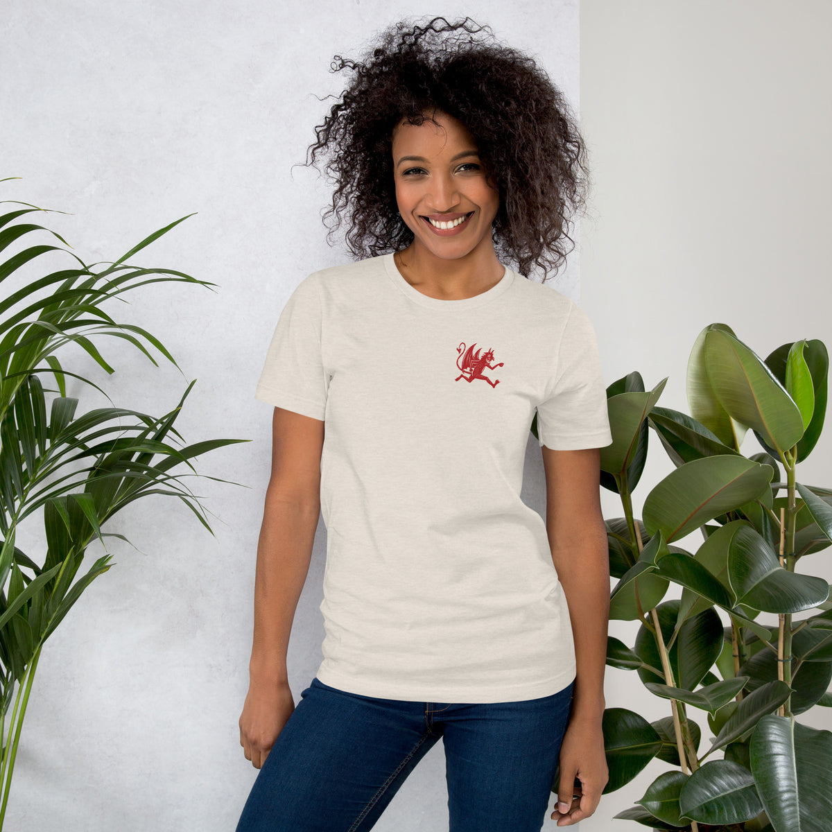 Artificial Perdition devil mascot, red illustrated devil mid-stride with trident and brand name, hand-drawn style on black, official logo tee