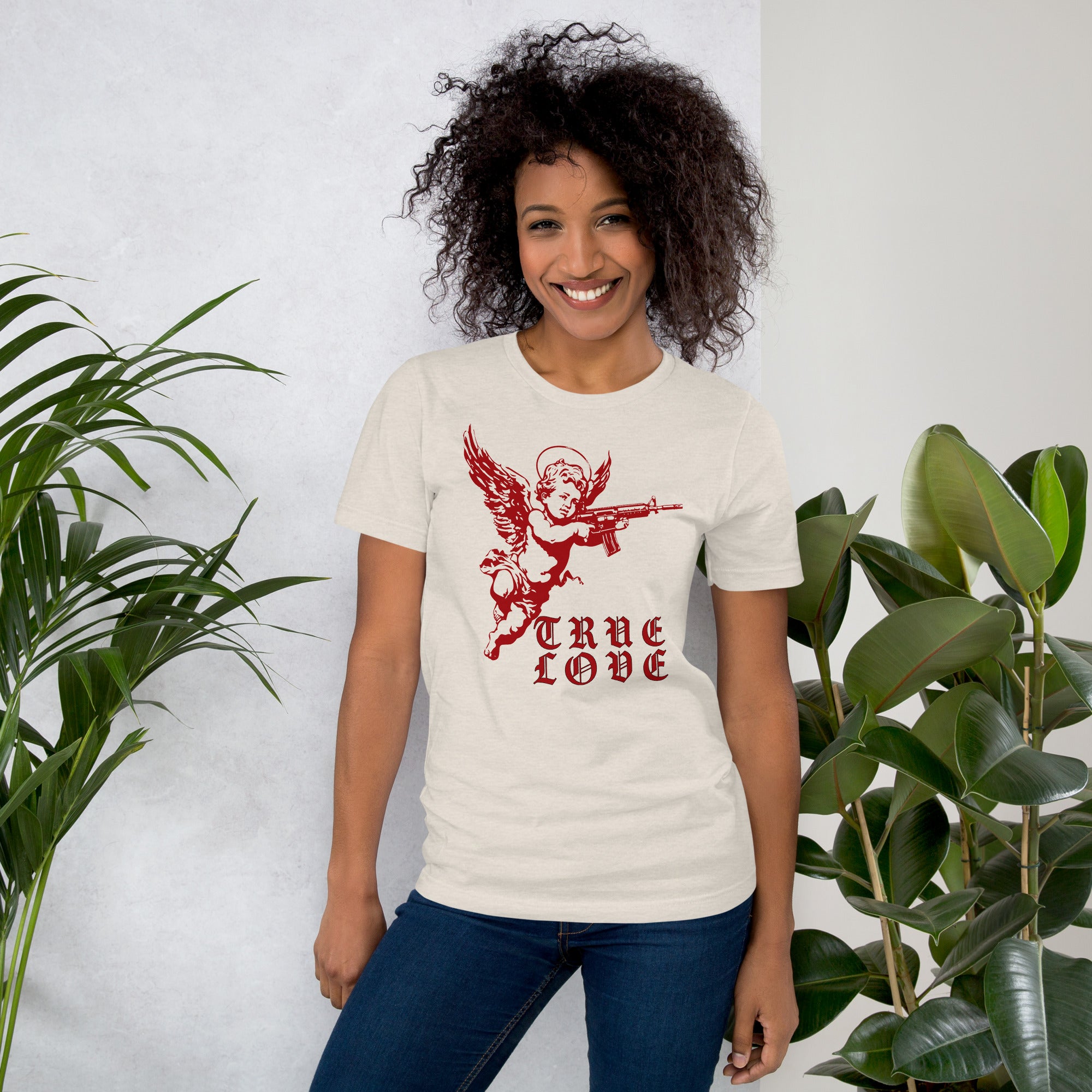 Red cherub angel with halo aiming rifle above blackletter True Love text, dark ironic tattoo flash style, Artificial Perdition apparel