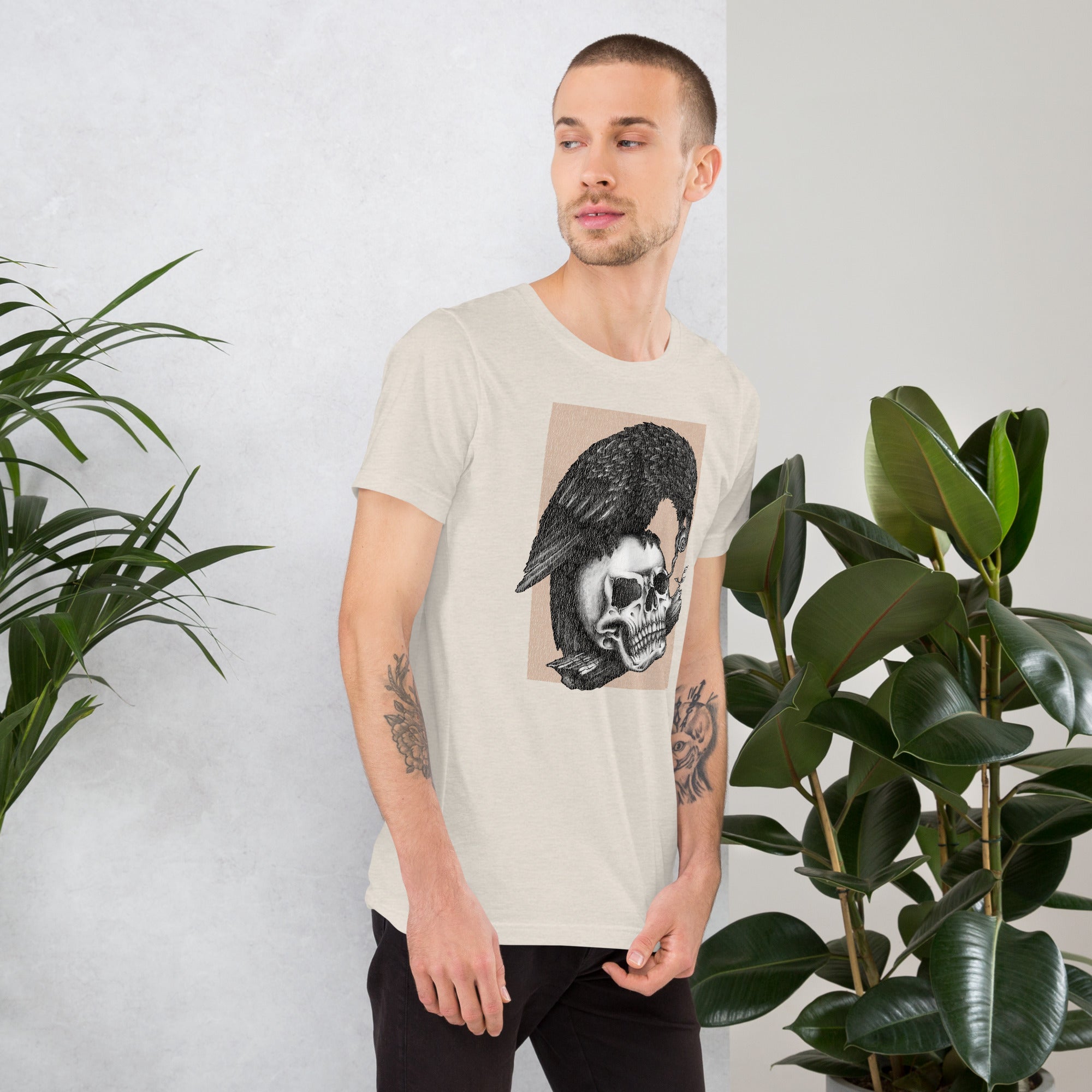 Graphite illustration of a black corvid perched on a human skull removing the eye, sprouting branch beside it, Last Look, Artificial Perdition apparel