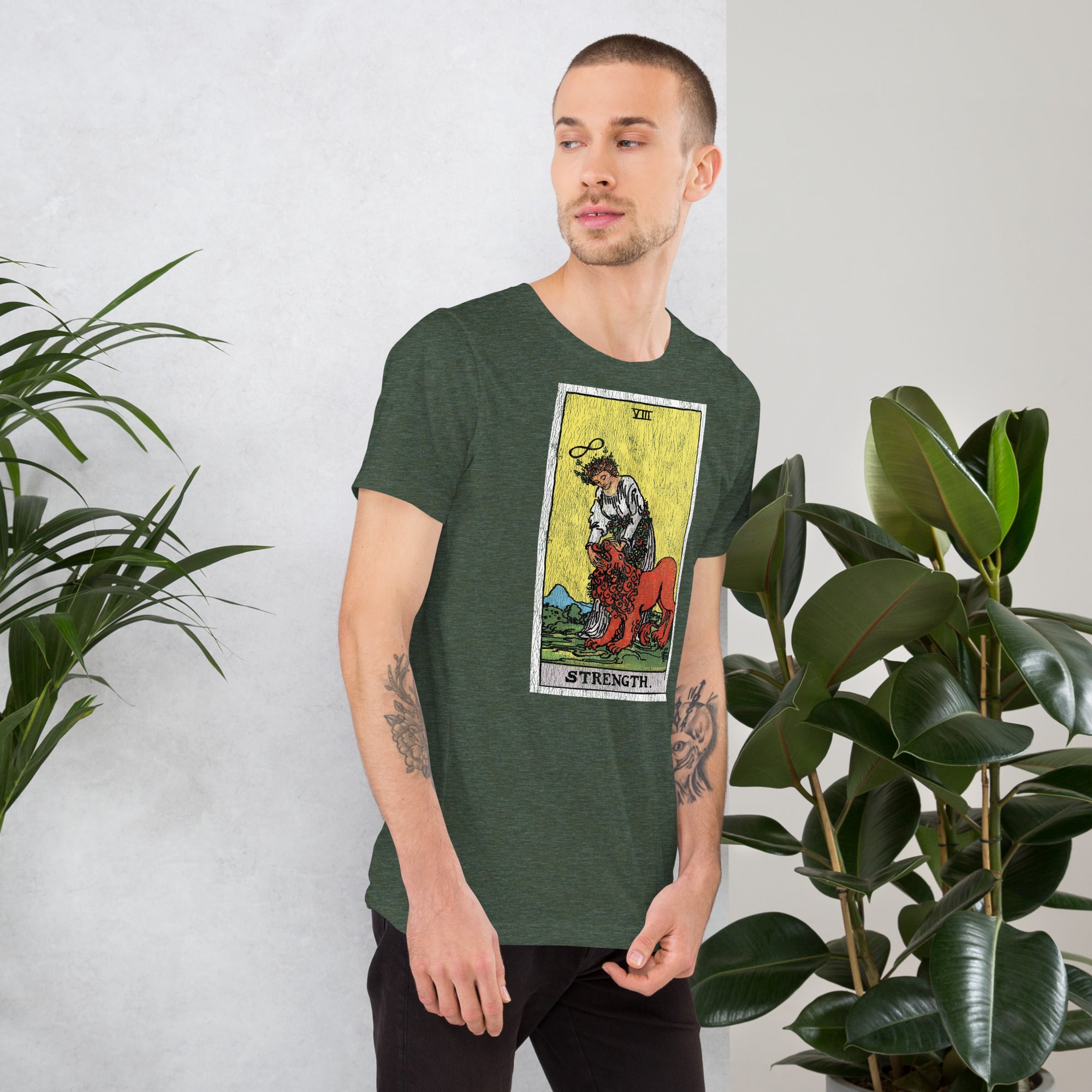 Card eight. The lion is already subdued, led by a chain of flowers. Strength is the quiet kind — fortitude, not force. Rider-Waite tarot apparel.