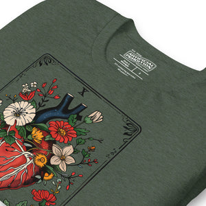 Tarot card illustration numbered X with an anatomical heart in bloom surrounded by wildflowers and vines, Amor Fati, Artificial Perdition apparel