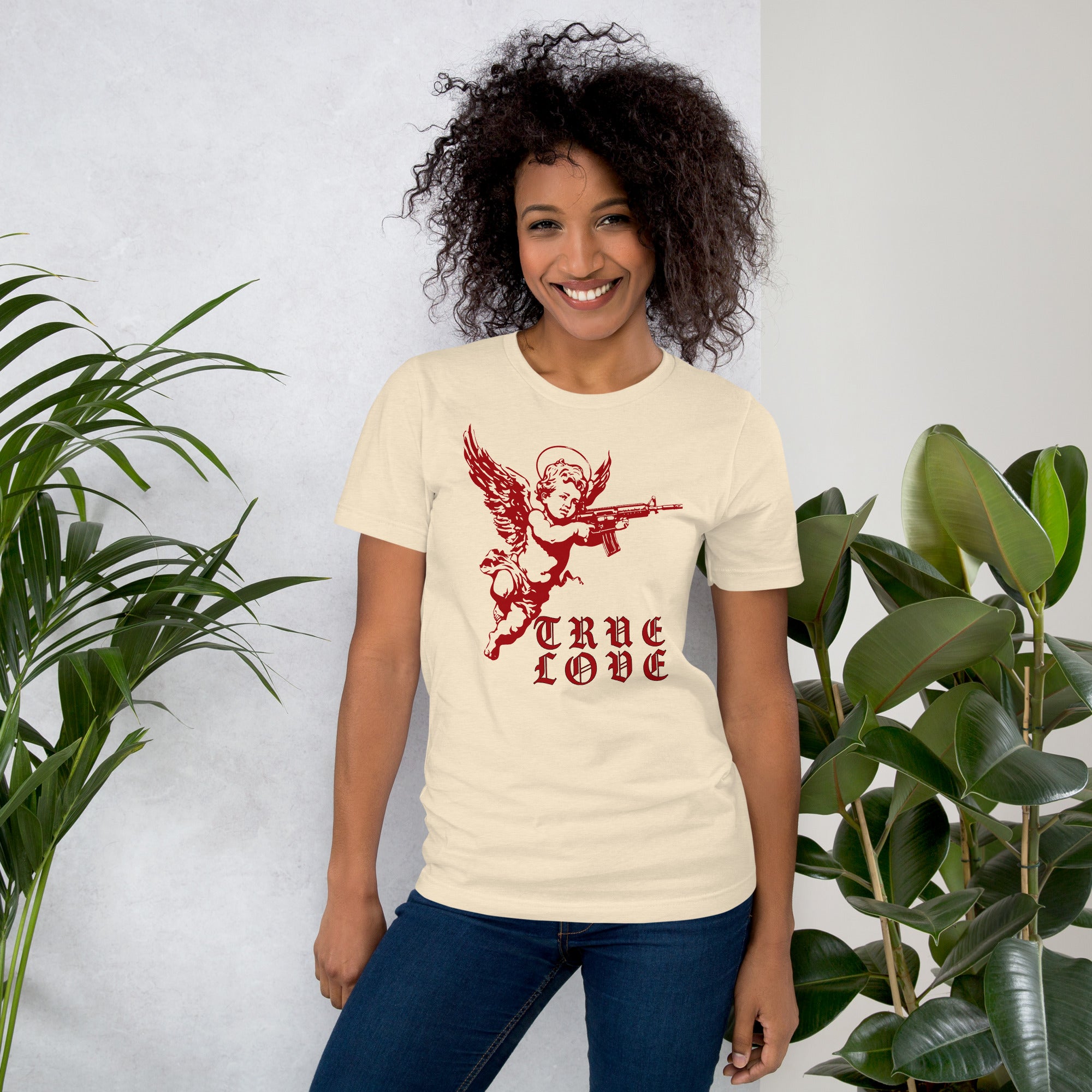 Red cherub angel with halo aiming rifle above blackletter True Love text, dark ironic tattoo flash style, Artificial Perdition apparel