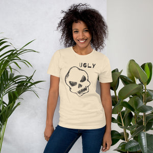 Crude hand-drawn skull with mismatched eye sockets and UGLY text in the upper corner, anti-polish graphic design, Artificial Perdition apparel