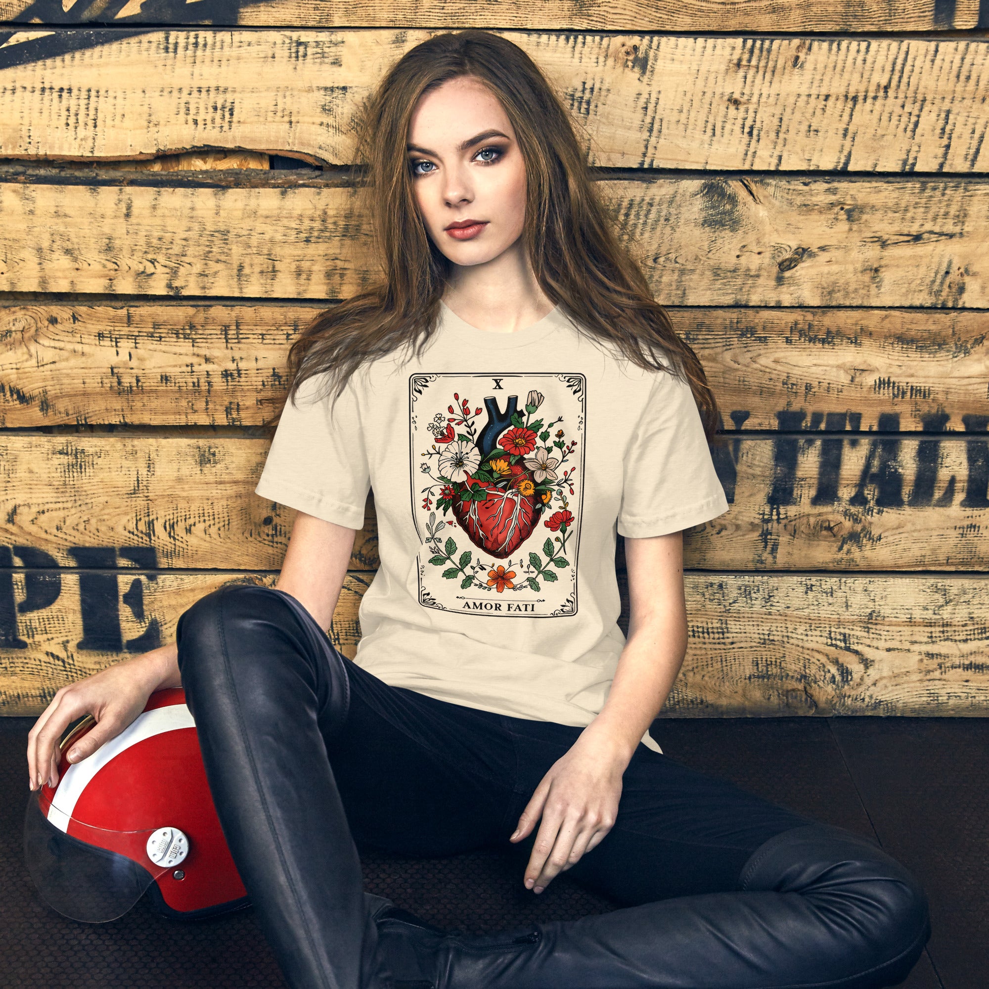 Tarot card illustration numbered X with an anatomical heart in bloom surrounded by wildflowers and vines, Amor Fati, Artificial Perdition apparel