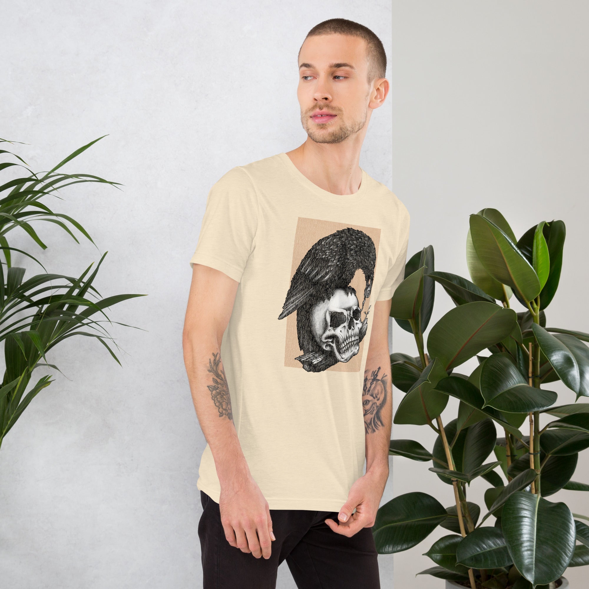 Graphite illustration of a black corvid perched on a human skull removing the eye, sprouting branch beside it, Last Look, Artificial Perdition apparel