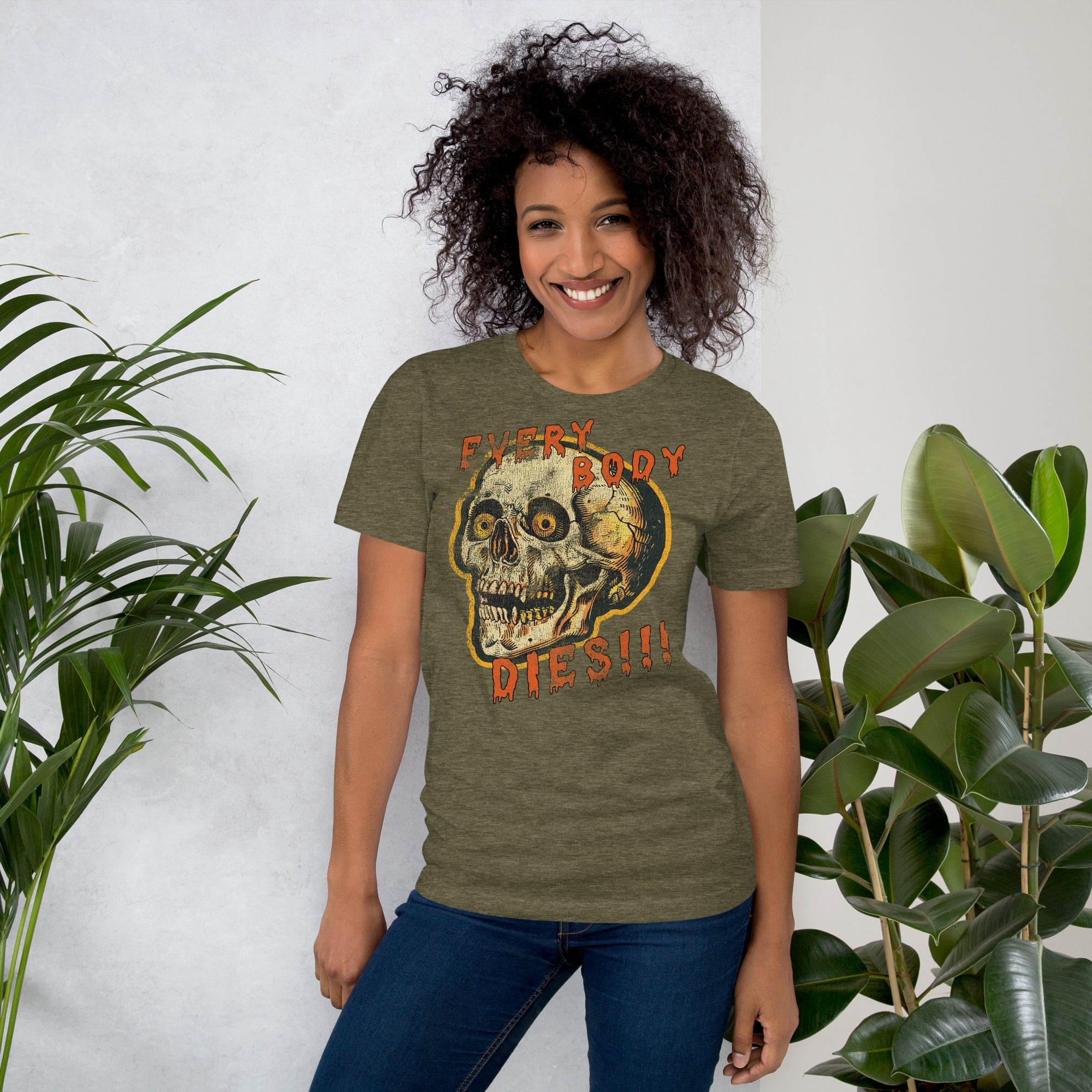 Die-cut skull with amber eyes and dripping orange horror font reading EVERY BODY DIES, vintage pulp style, Artificial Perdition apparel