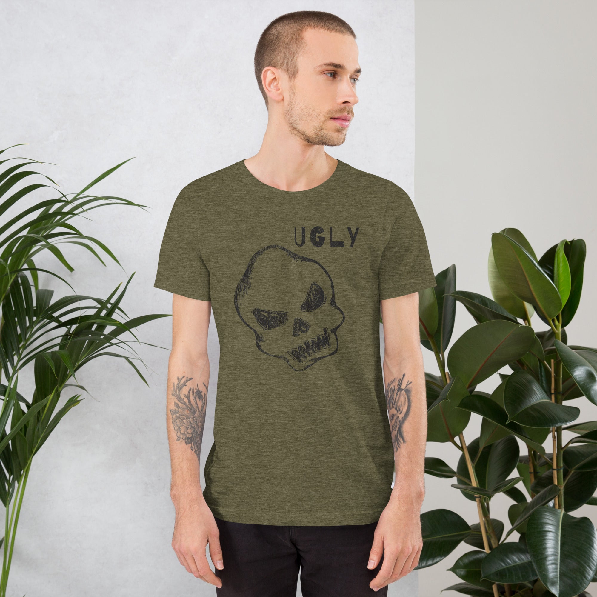 Crude hand-drawn skull with mismatched eye sockets and UGLY text in the upper corner, anti-polish graphic design, Artificial Perdition apparel