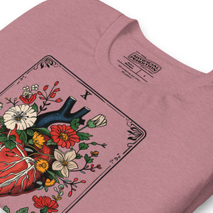 Tarot card illustration numbered X with an anatomical heart in bloom surrounded by wildflowers and vines, Amor Fati, Artificial Perdition apparel