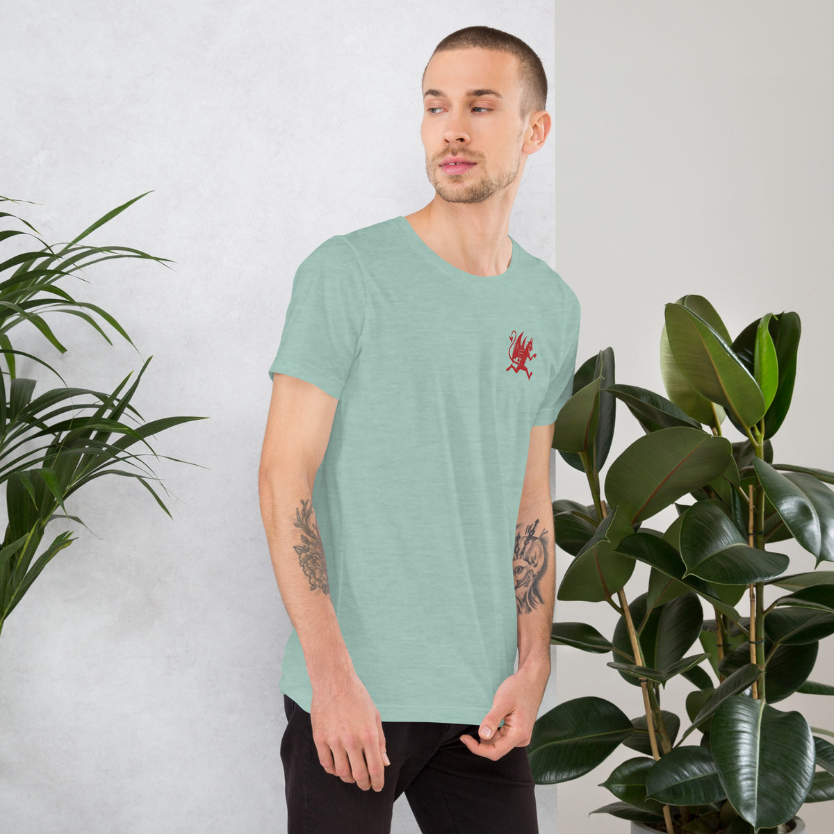 Artificial Perdition devil mascot, red illustrated devil mid-stride with trident and brand name, hand-drawn style on black, official logo tee