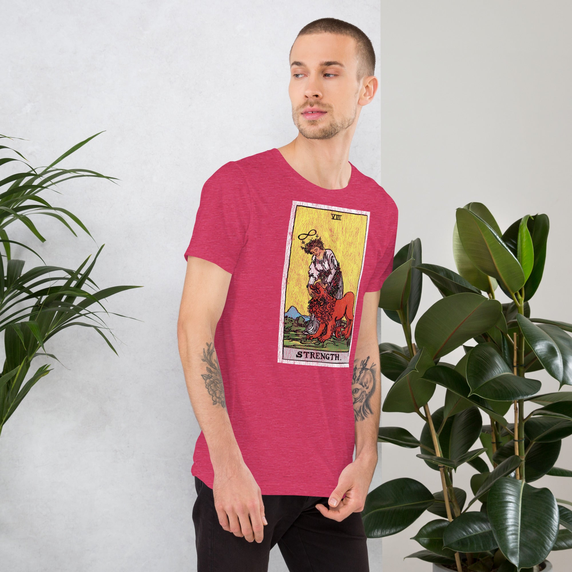 Card eight. The lion is already subdued, led by a chain of flowers. Strength is the quiet kind — fortitude, not force. Rider-Waite tarot apparel.