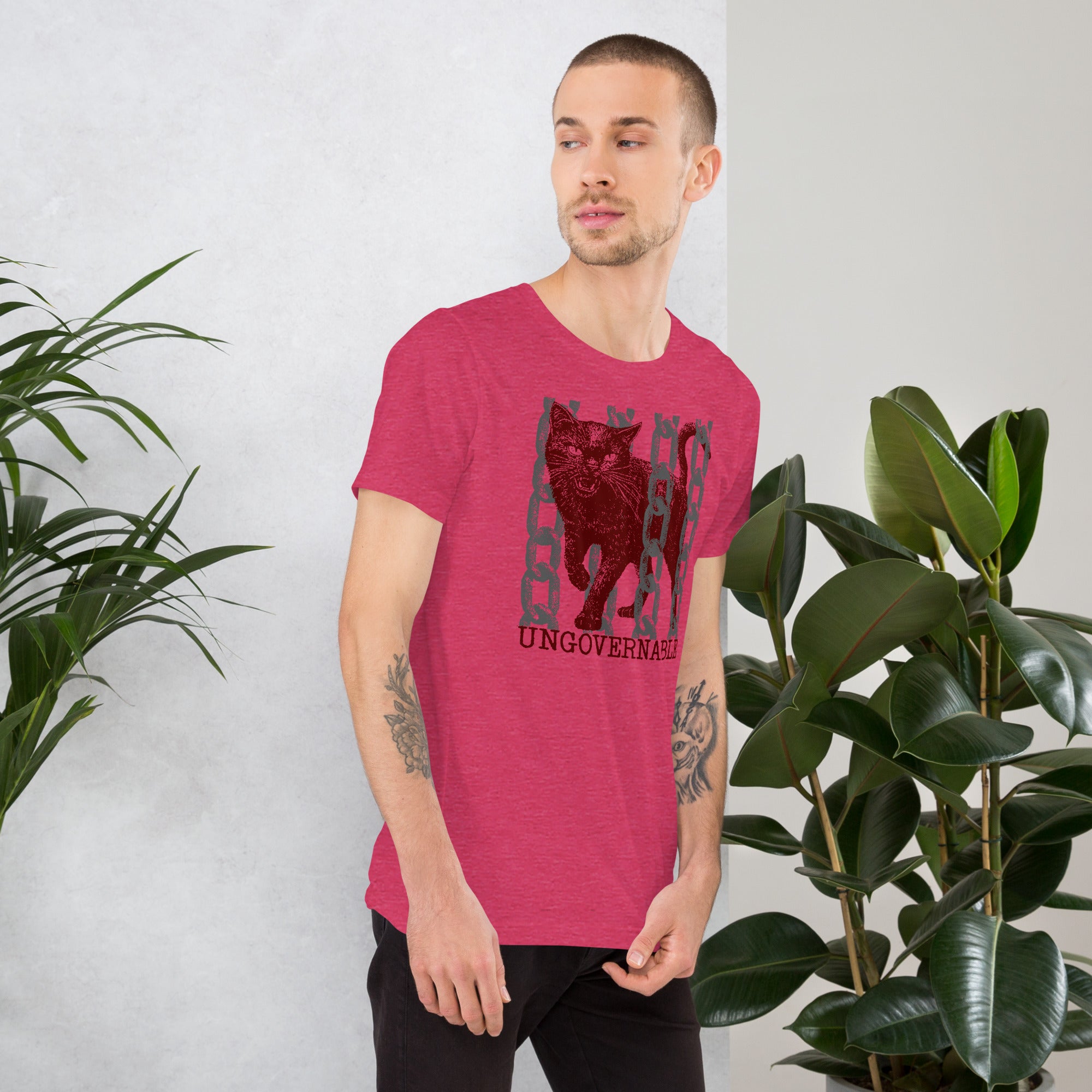 Product mockupSnarling cat breaking through chains with UNGOVERNABLE text, dithered halftone red on cream, Artificial Perdition apparel