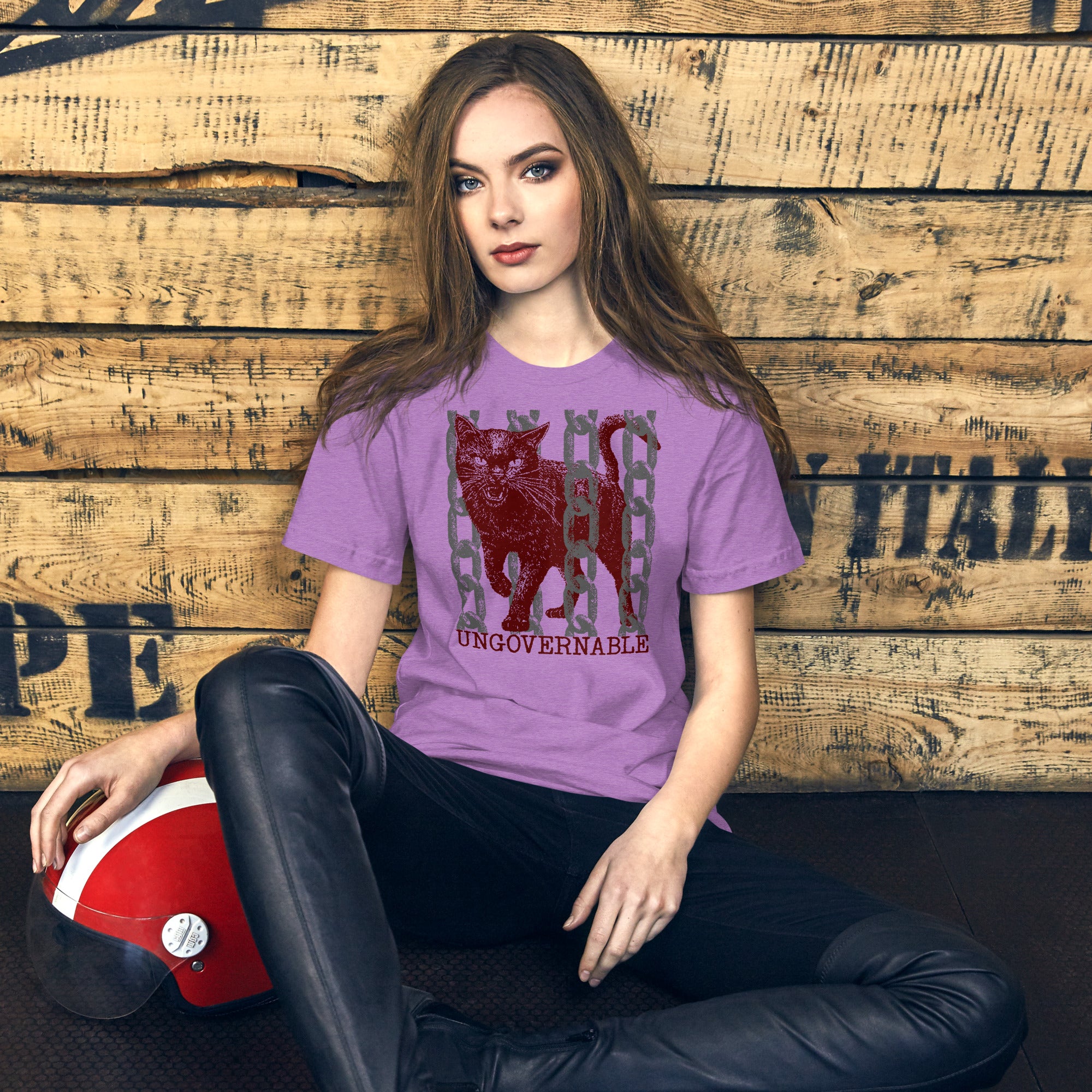 Product mockupSnarling cat breaking through chains with UNGOVERNABLE text, dithered halftone red on cream, Artificial Perdition apparel
