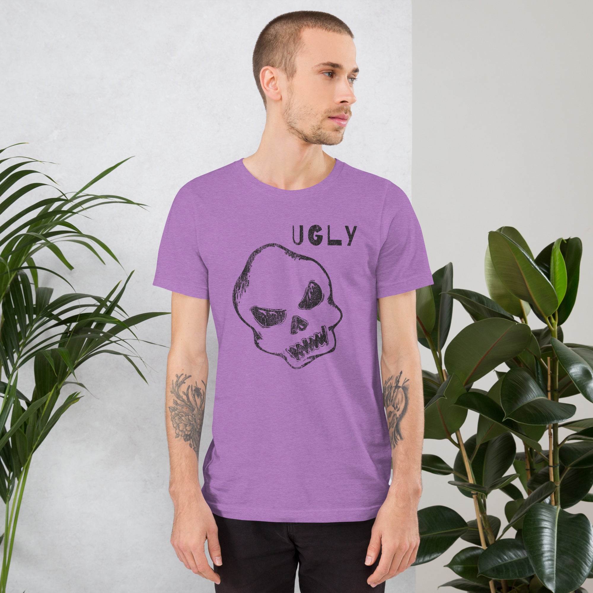 Crude hand-drawn skull with mismatched eye sockets and UGLY text in the upper corner, anti-polish graphic design, Artificial Perdition apparel