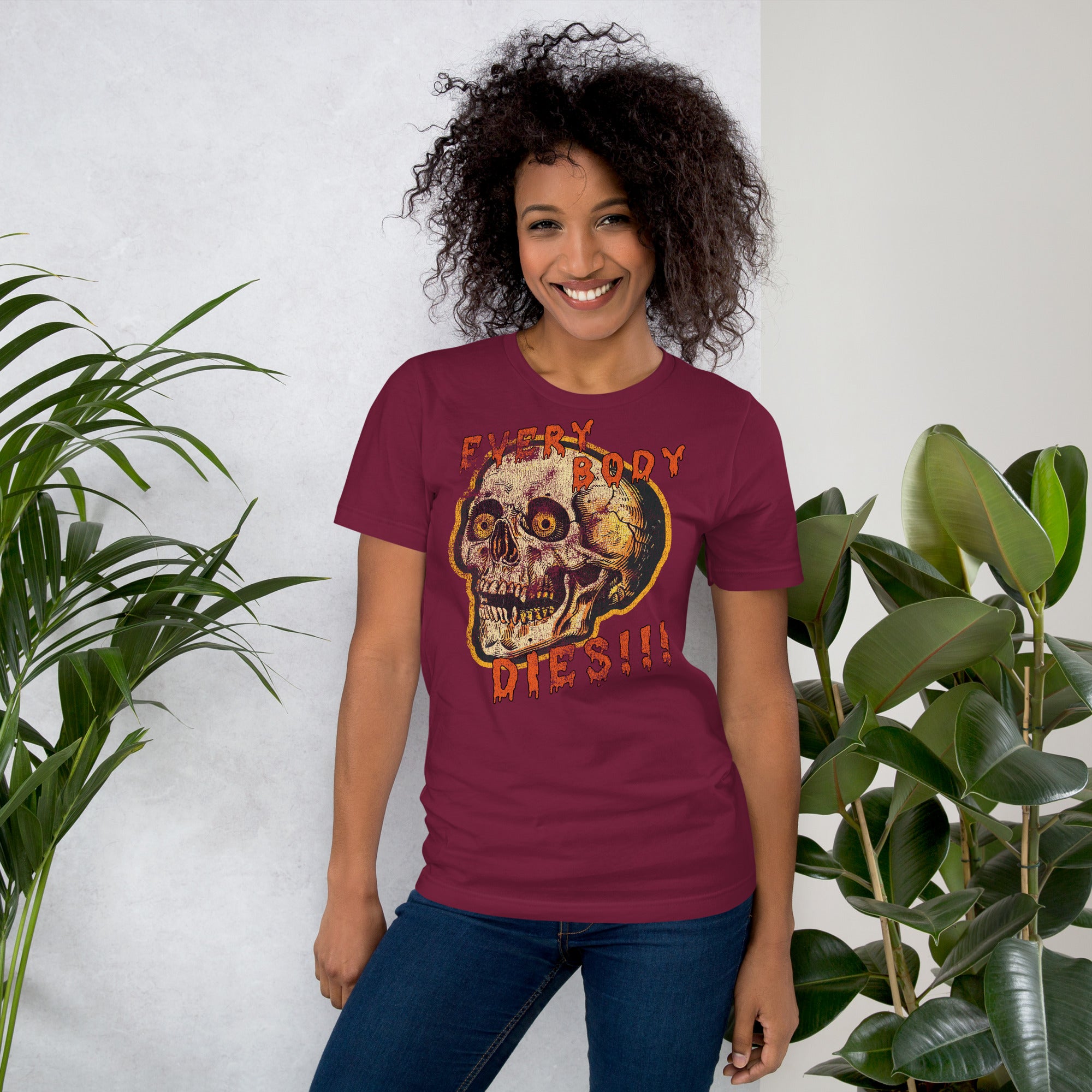 Die-cut skull with amber eyes and dripping orange horror font reading EVERY BODY DIES, vintage pulp style, Artificial Perdition apparel