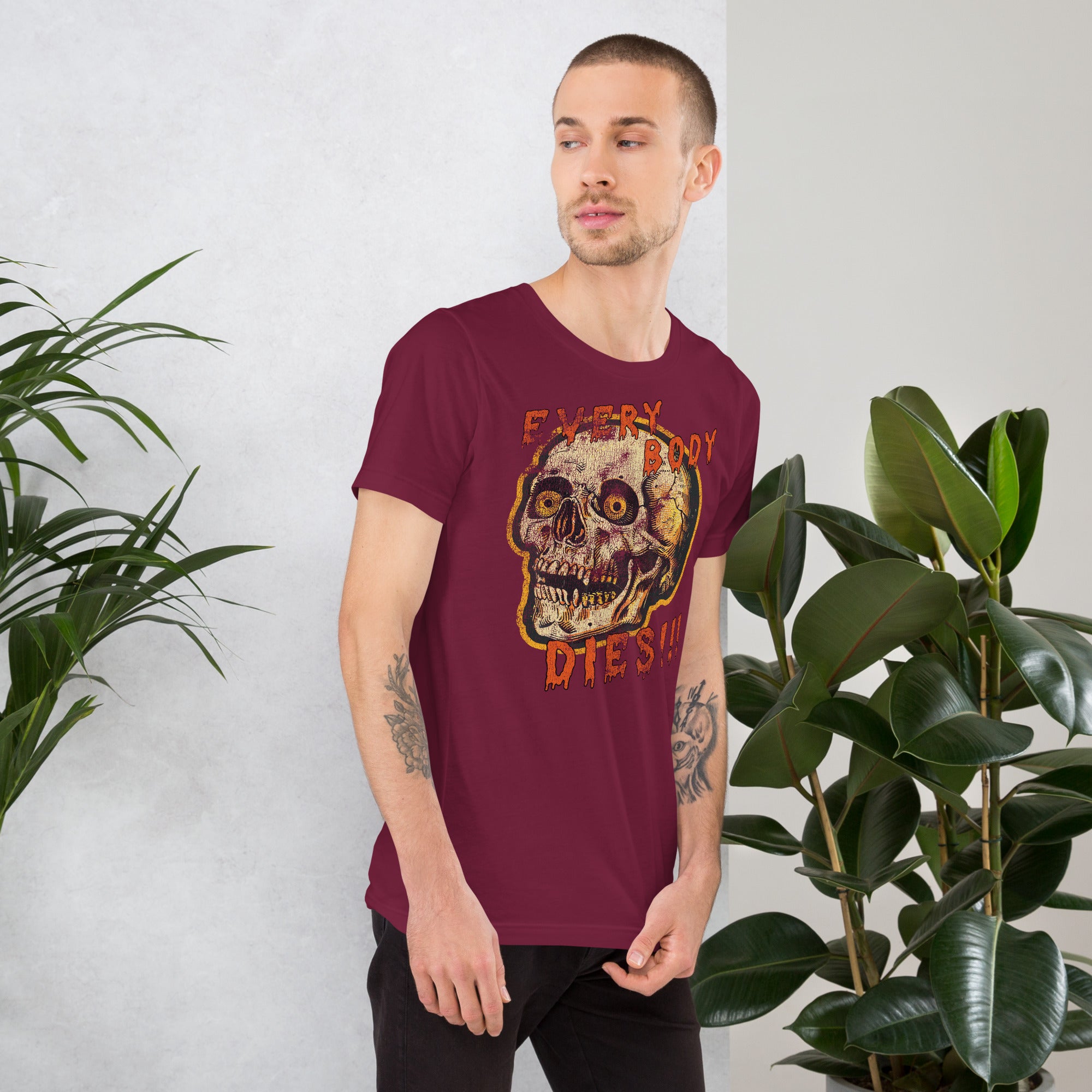 Die-cut skull with amber eyes and dripping orange horror font reading EVERY BODY DIES, vintage pulp style, Artificial Perdition apparel
