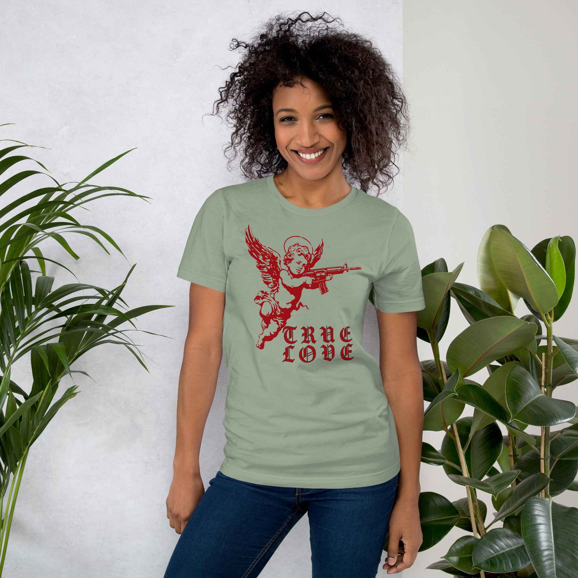 Red cherub angel with halo aiming rifle above blackletter True Love text, dark ironic tattoo flash style, Artificial Perdition apparel