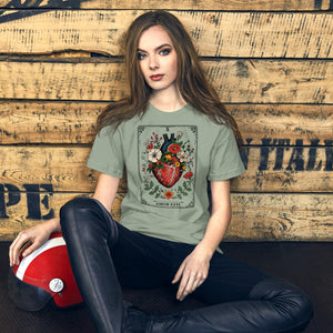 Tarot card illustration numbered X with an anatomical heart in bloom surrounded by wildflowers and vines, Amor Fati, Artificial Perdition apparel