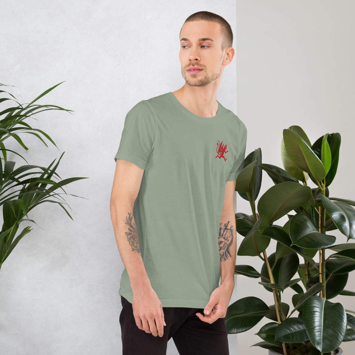 Artificial Perdition devil mascot, red illustrated devil mid-stride with trident and brand name, hand-drawn style on black, official logo tee