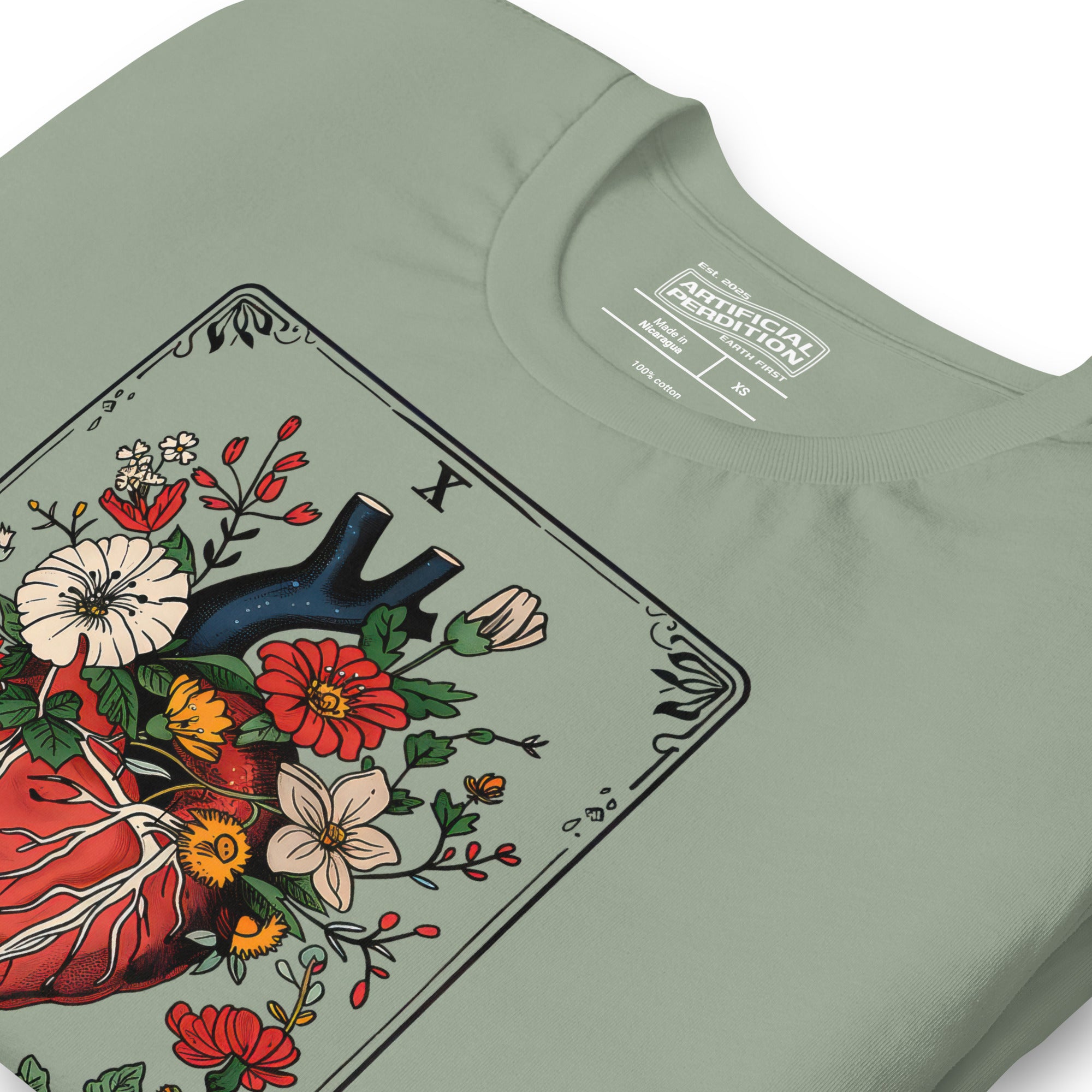 Tarot card illustration numbered X with an anatomical heart in bloom surrounded by wildflowers and vines, Amor Fati, Artificial Perdition apparel
