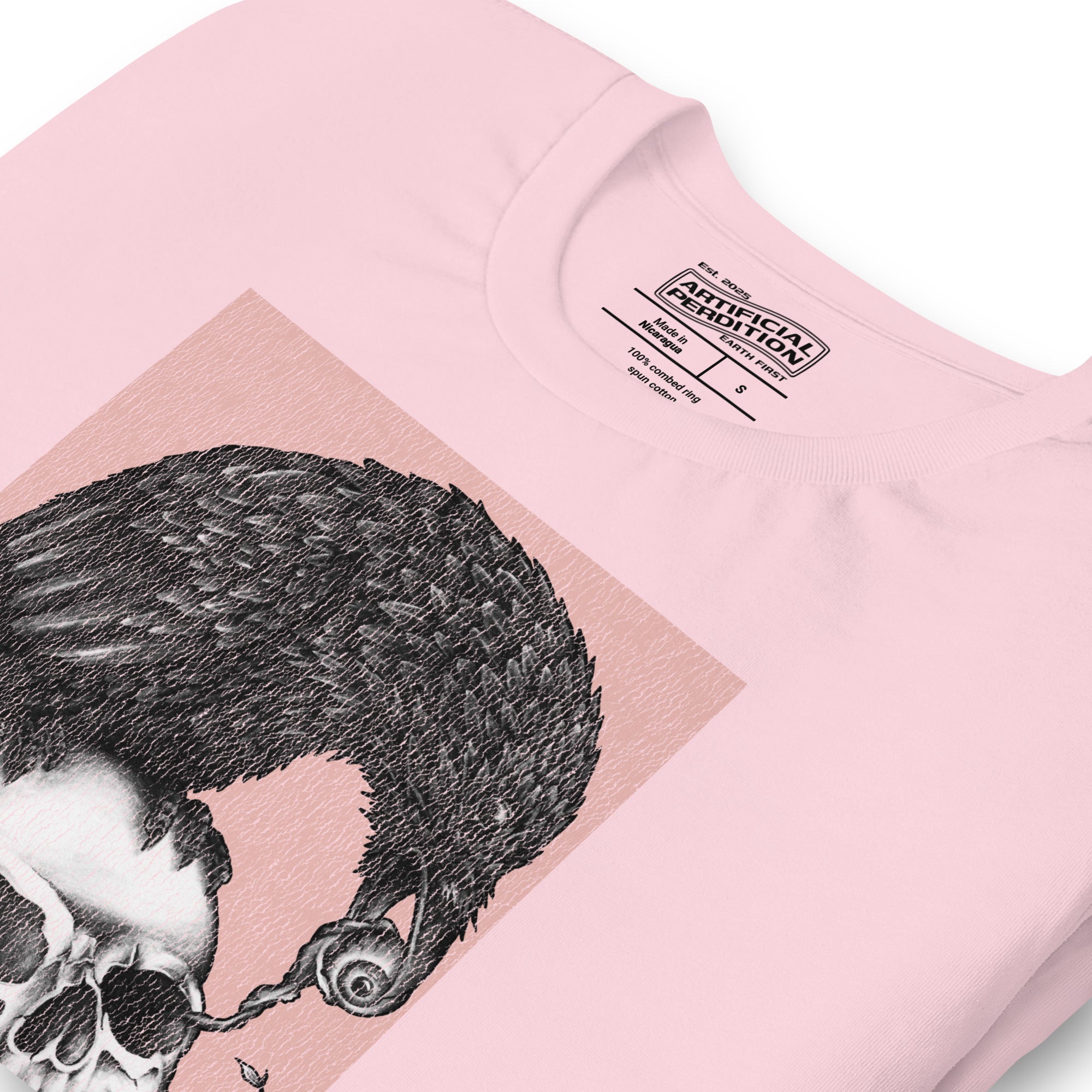 Graphite illustration of a black corvid perched on a human skull removing the eye, sprouting branch beside it, Last Look, Artificial Perdition apparel