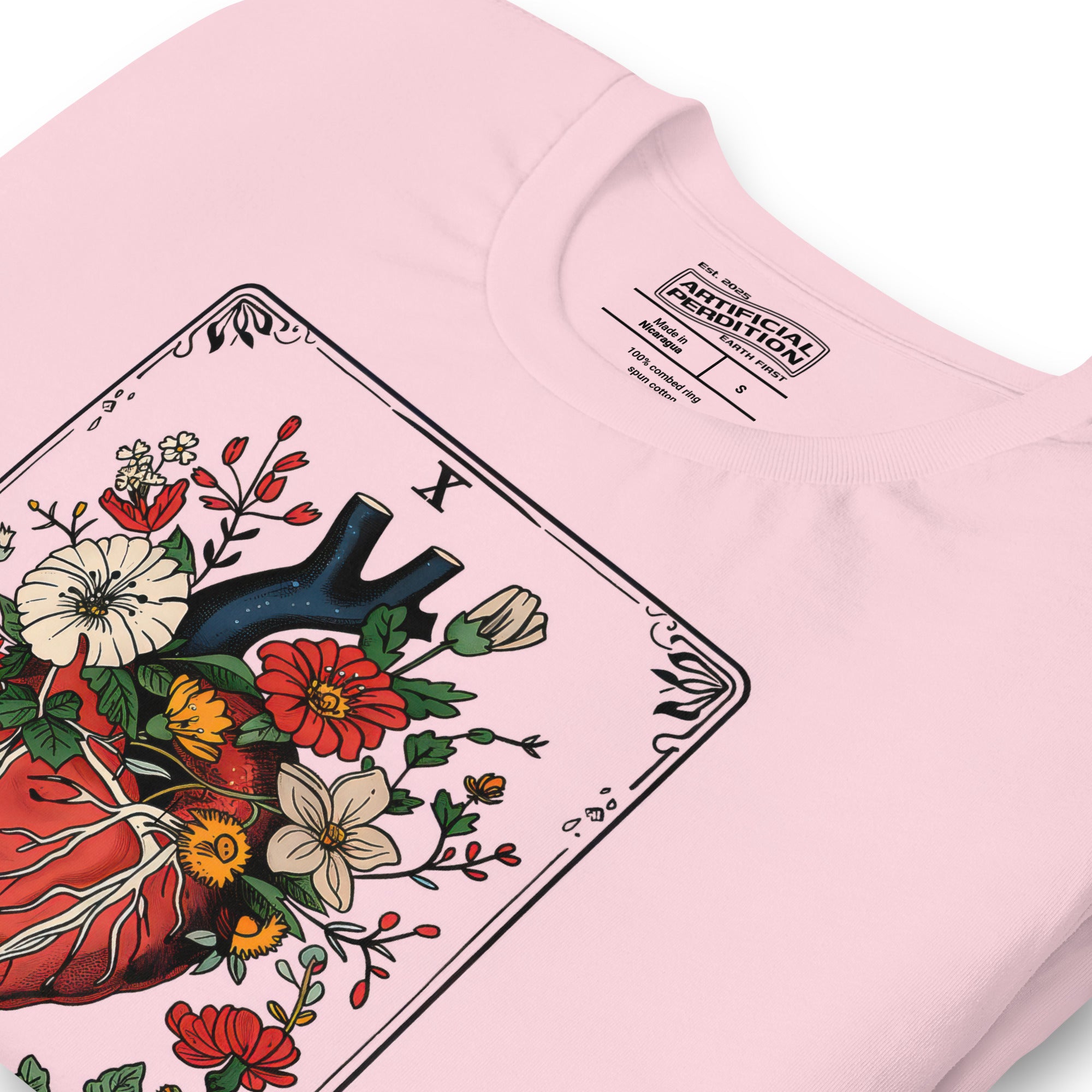 Tarot card illustration numbered X with an anatomical heart in bloom surrounded by wildflowers and vines, Amor Fati, Artificial Perdition apparel