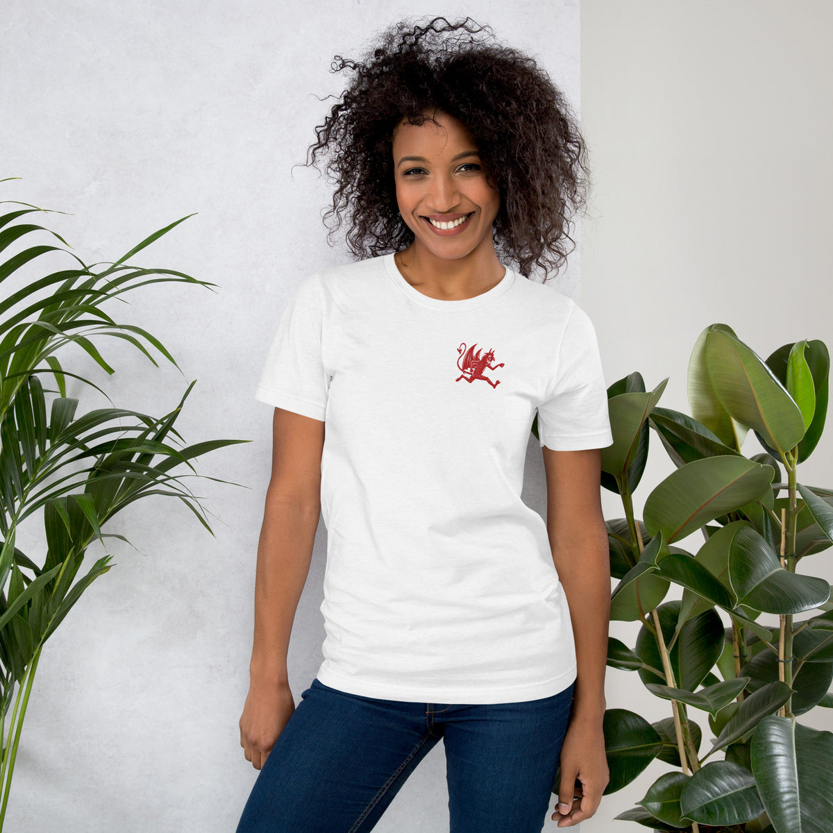 Artificial Perdition devil mascot, red illustrated devil mid-stride with trident and brand name, hand-drawn style on black, official logo tee
