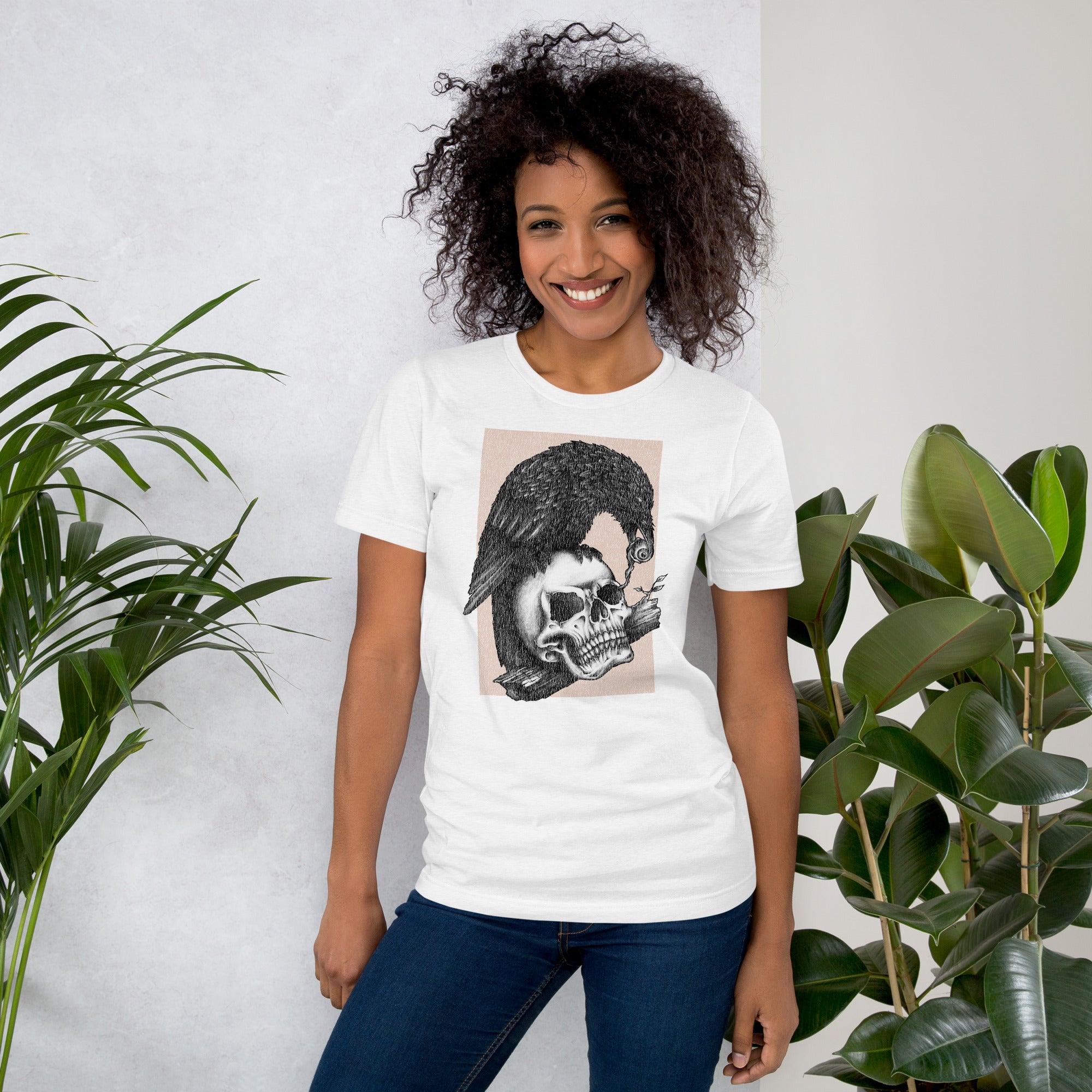 Graphite illustration of a black corvid perched on a human skull removing the eye, sprouting branch beside it, Last Look, Artificial Perdition apparel