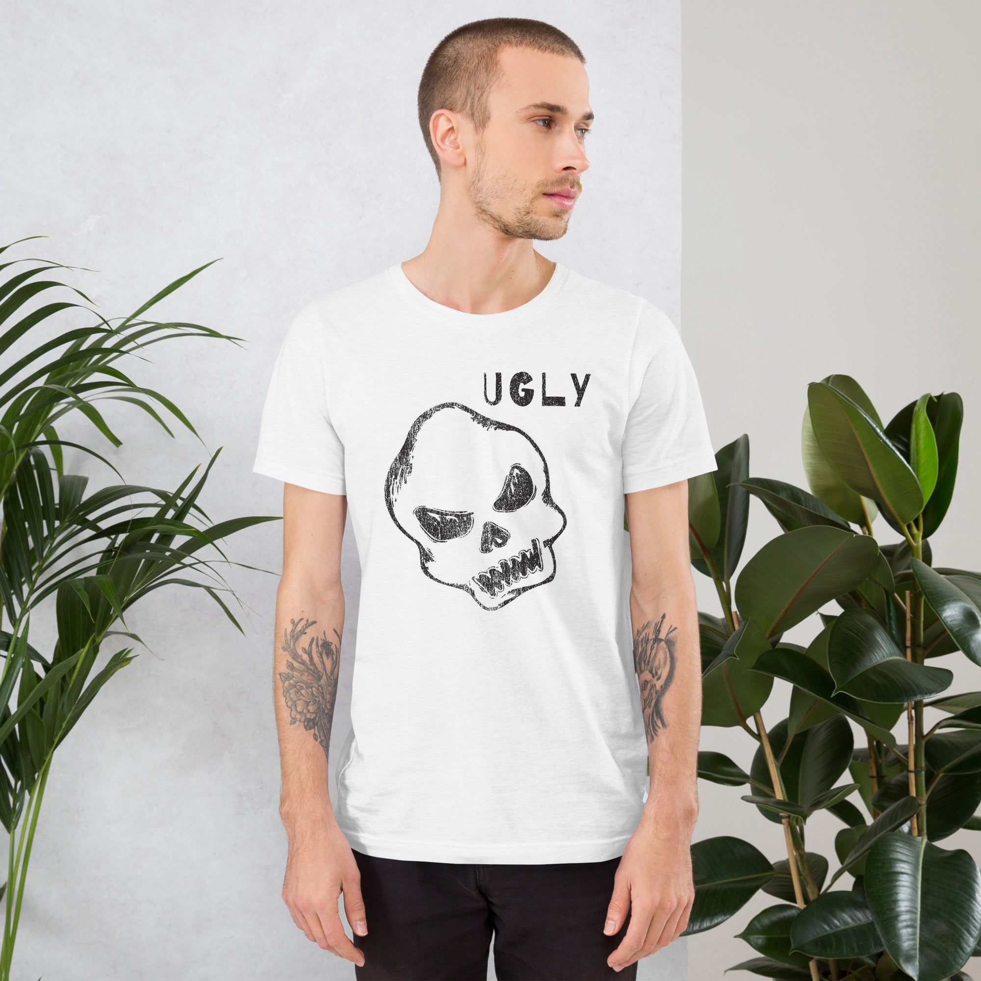 Crude hand-drawn skull with mismatched eye sockets and UGLY text in the upper corner, anti-polish graphic design, Artificial Perdition apparel
