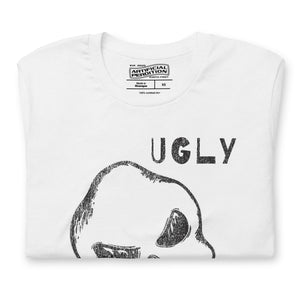Crude hand-drawn skull with mismatched eye sockets and UGLY text in the upper corner, anti-polish graphic design, Artificial Perdition apparel
