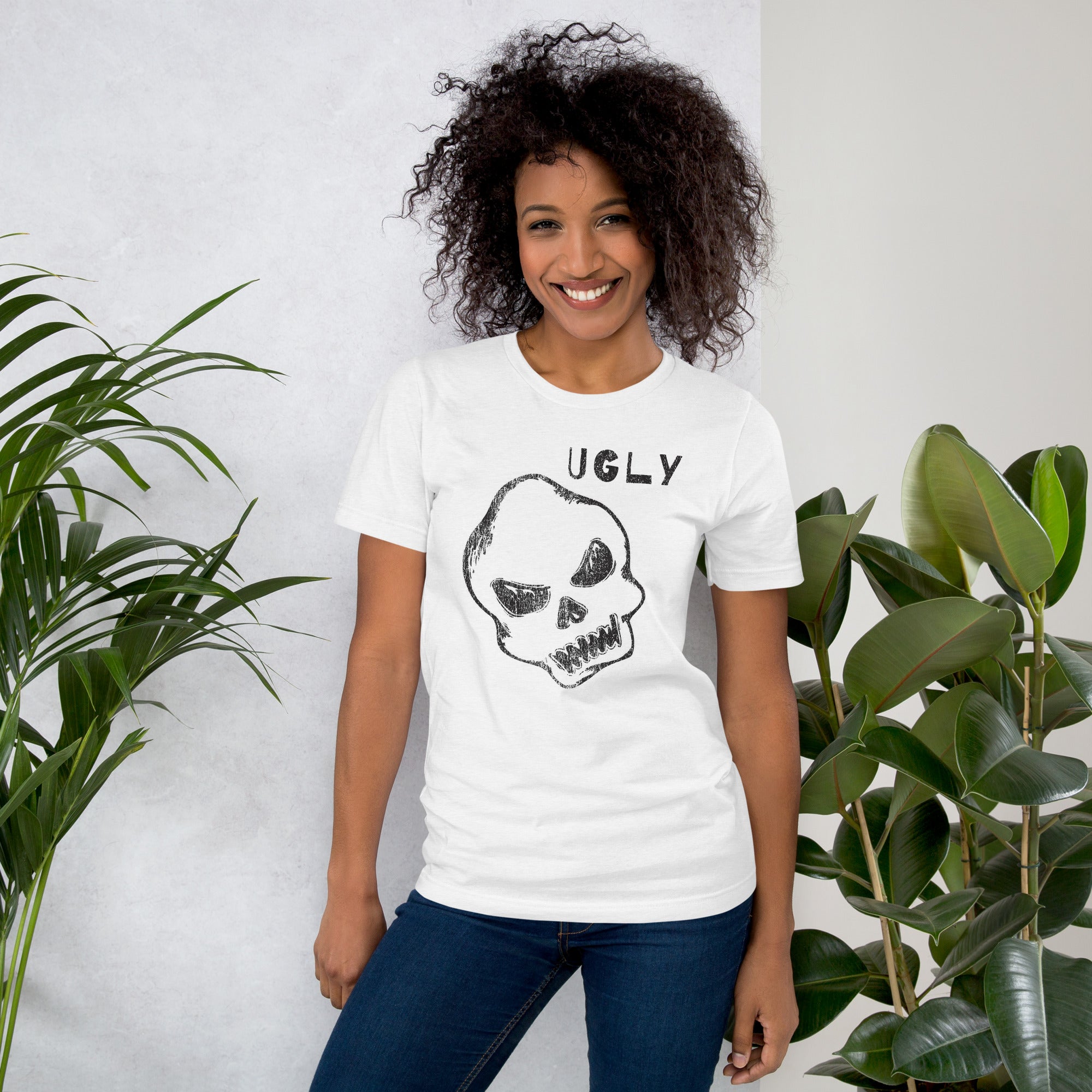 Crude hand-drawn skull with mismatched eye sockets and UGLY text in the upper corner, anti-polish graphic design, Artificial Perdition apparel