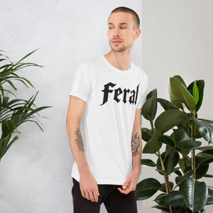 Feral in white blackletter font on dark heather grey t-shirt, bold single word graphic design, Artificial Perdition apparel