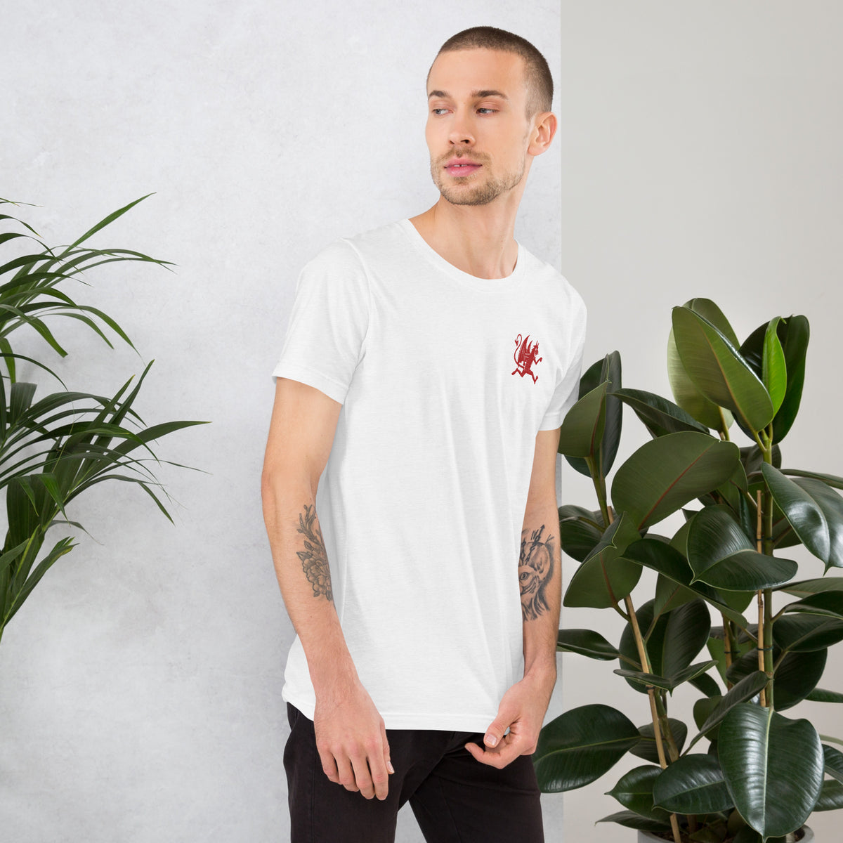 Artificial Perdition devil mascot, red illustrated devil mid-stride with trident and brand name, hand-drawn style on black, official logo tee