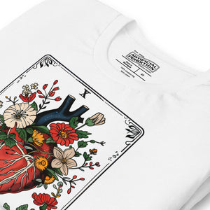 Tarot card illustration numbered X with an anatomical heart in bloom surrounded by wildflowers and vines, Amor Fati, Artificial Perdition apparel
