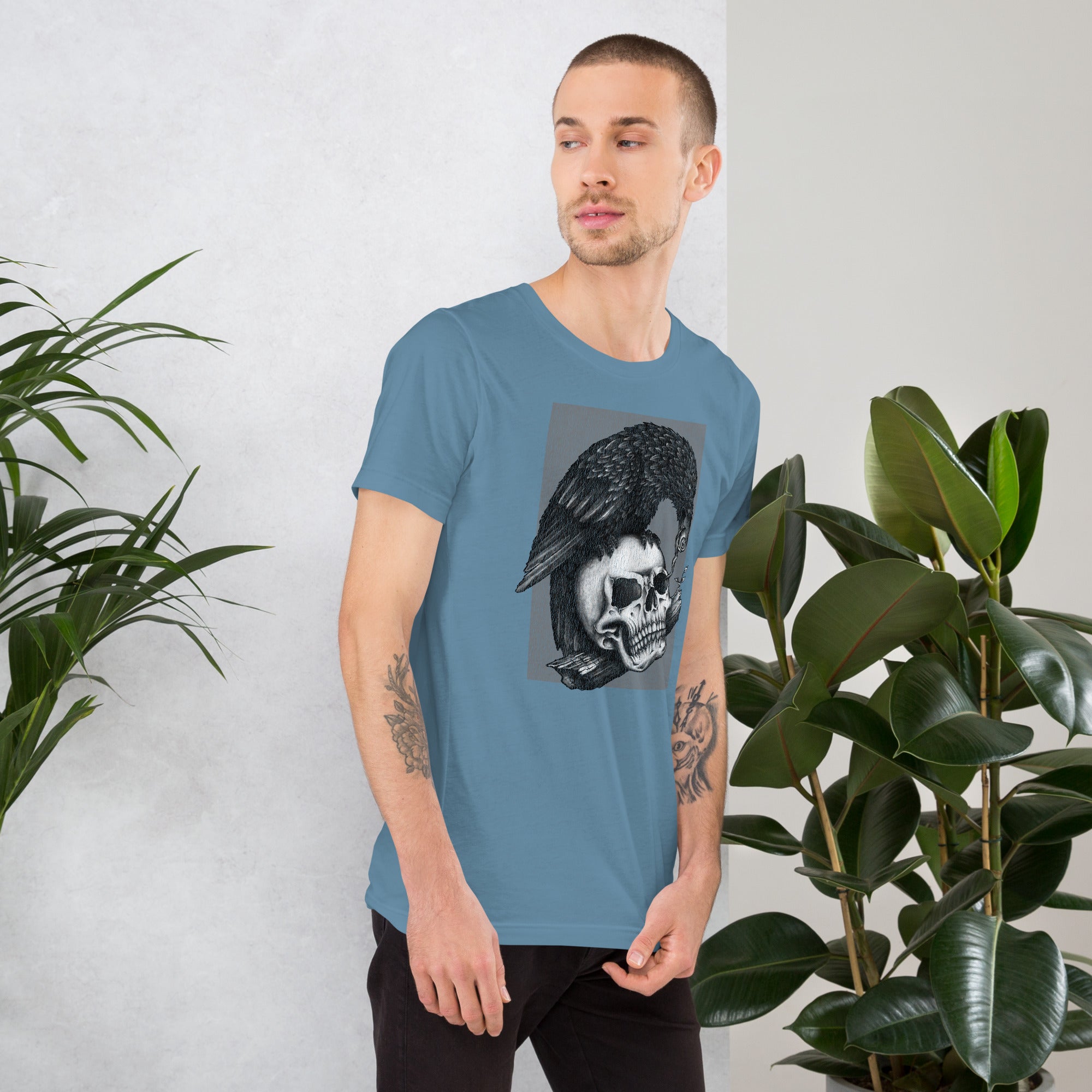 Graphite illustration of a black corvid perched on a human skull removing the eye, sprouting branch beside it, Last Look, Artificial Perdition apparel