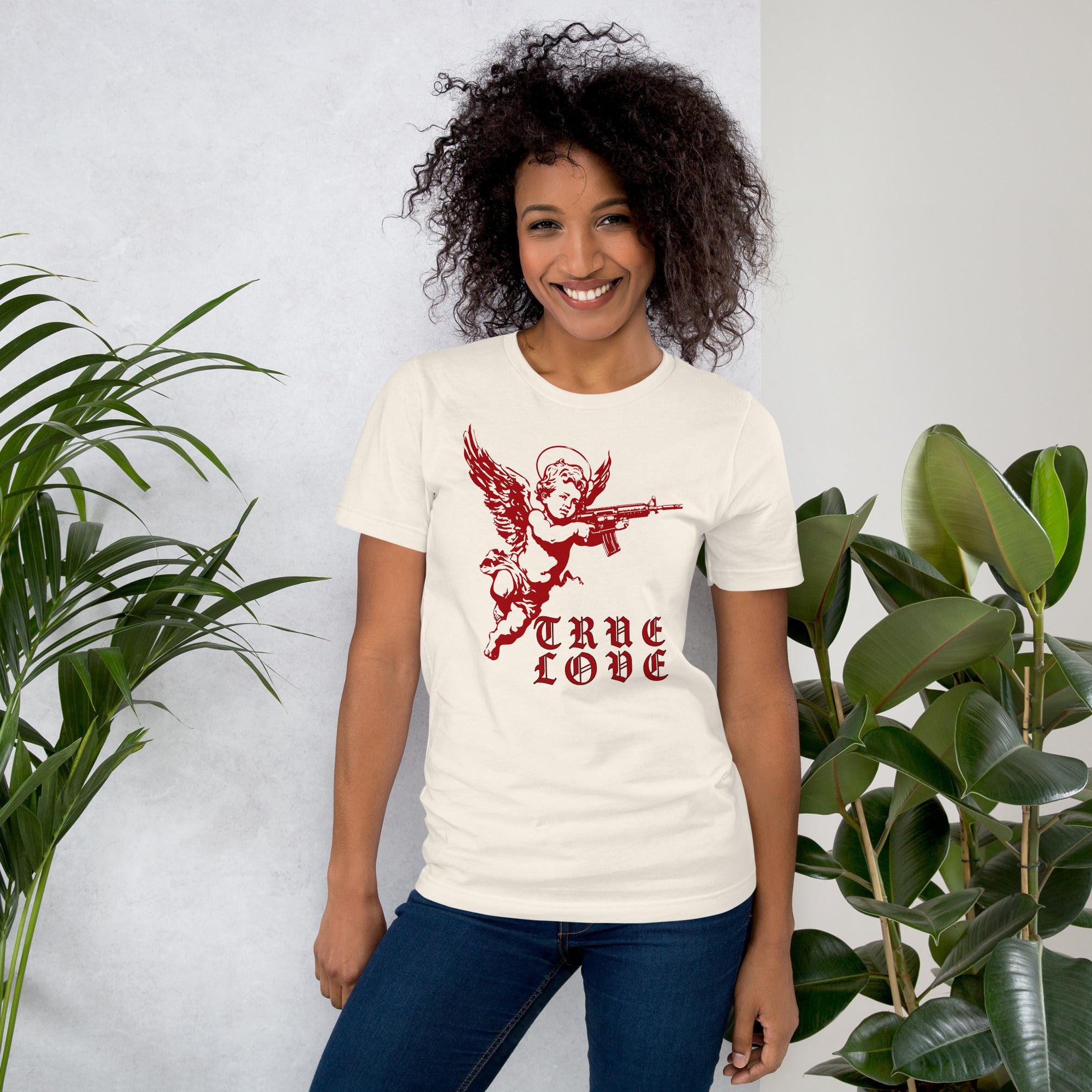 Red cherub angel with halo aiming rifle above blackletter True Love text, dark ironic tattoo flash style, Artificial Perdition apparel