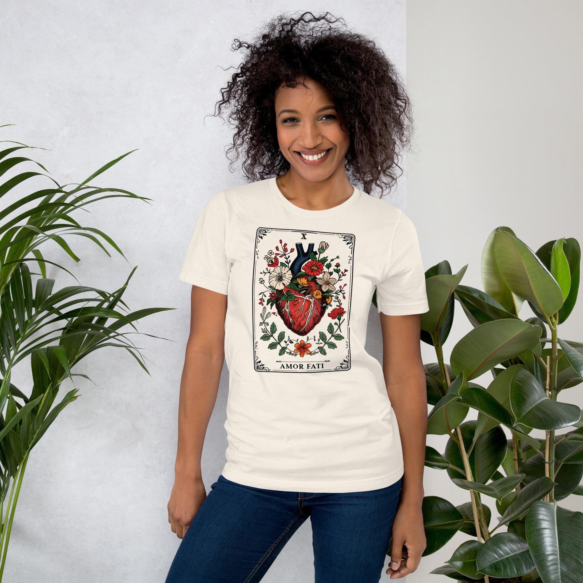 Tarot card illustration numbered X with an anatomical heart in bloom surrounded by wildflowers and vines, Amor Fati, Artificial Perdition apparel