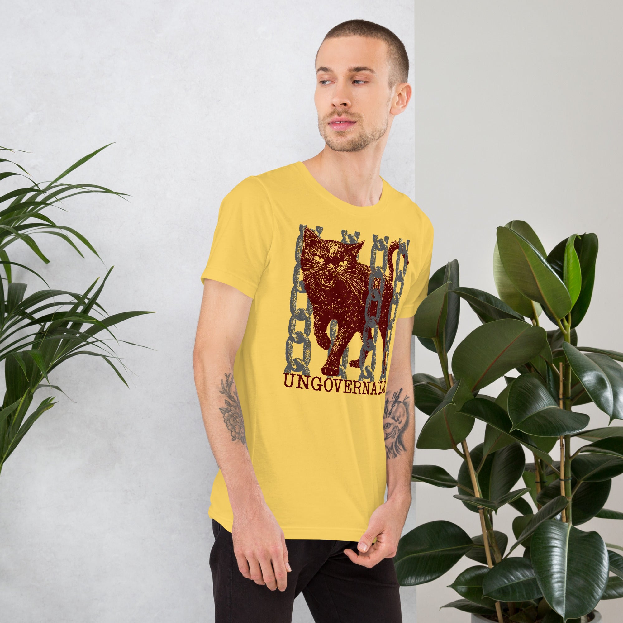 Snarling cat breaking through chains with UNGOVERNABLE text, dithered halftone red on cream, Artificial Perdition apparel