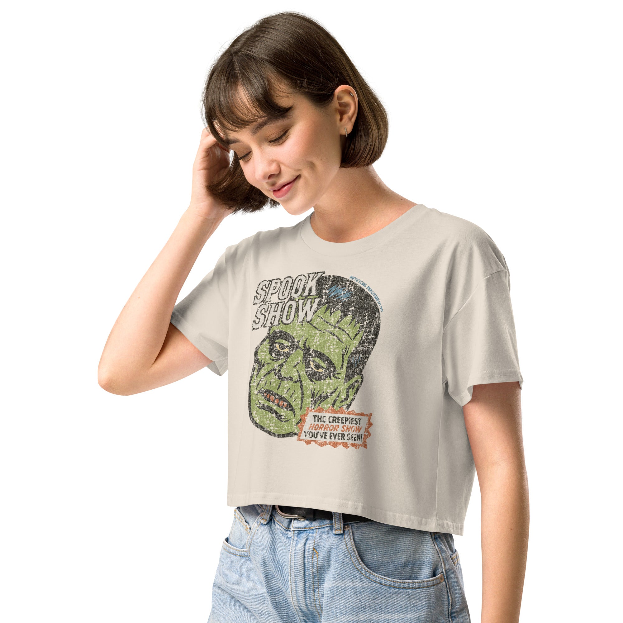 A side view of a distressed Frankenstein head with “Spook Show” on premium bone crop top.