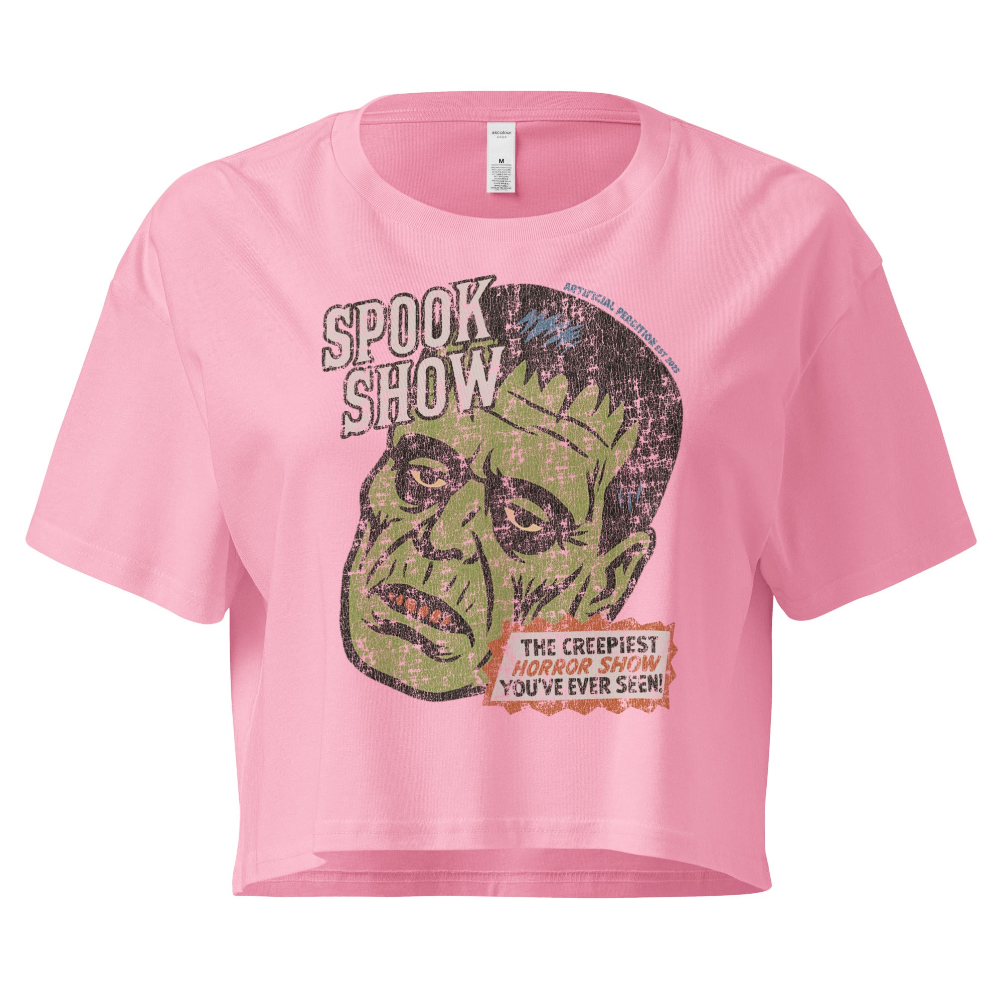 A distressed Frankenstein head with “Spook Show” on premium bubblegum pink crop top.