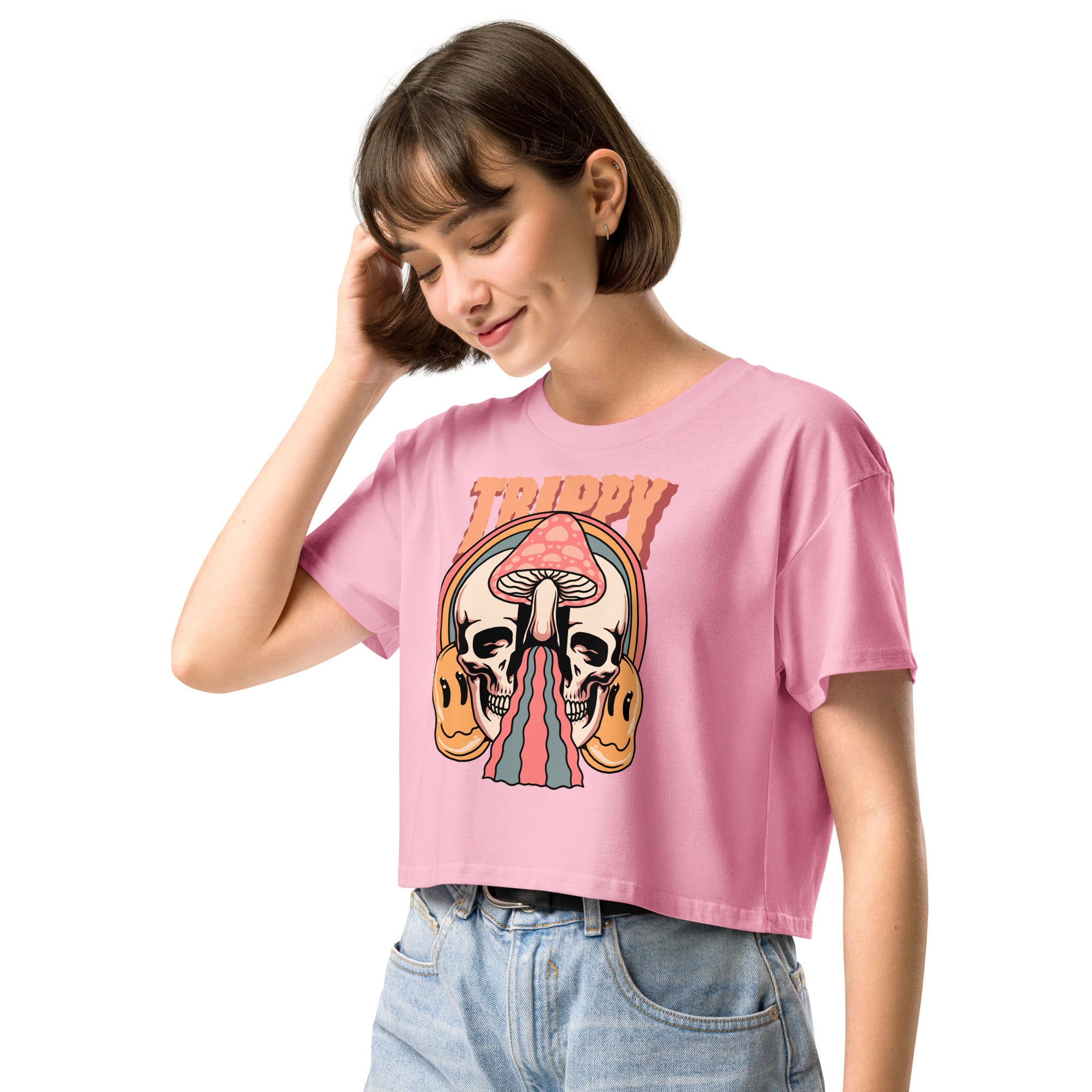 Cropped tee featuring a split skull and mushroom design with melting psychedelic color and smiley faces. Soft combed cotton, eco-friendly inks, playful surreal vibe.
