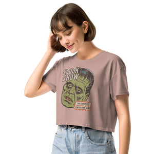 A side view of a distressed Frankenstein head with “Spook Show” on premium hazy pink crop top.