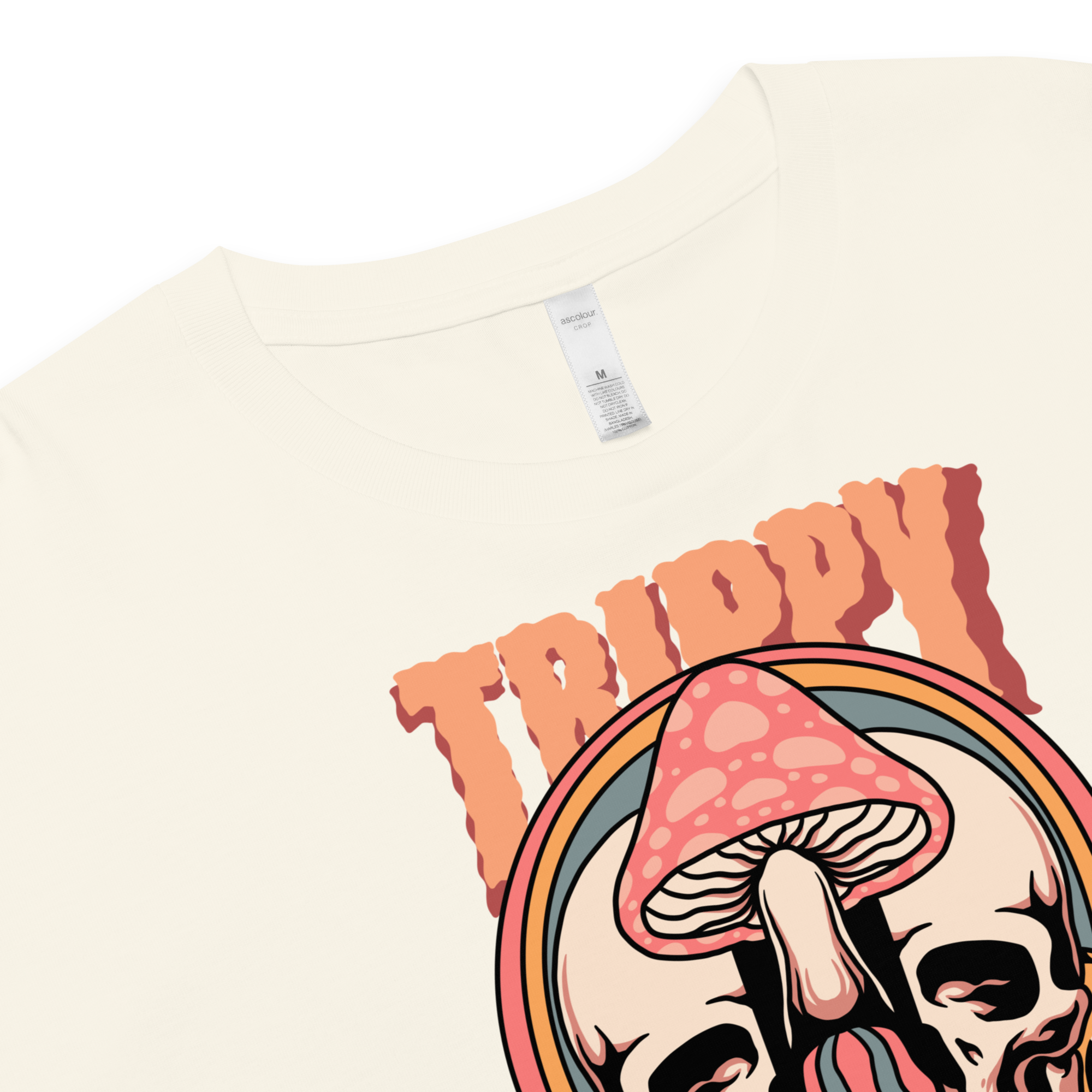 Cropped tee featuring a split skull and mushroom design with melting psychedelic color and smiley faces. Soft combed cotton, eco-friendly inks, playful surreal vibe.