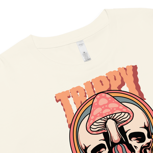Cropped tee featuring a split skull and mushroom design with melting psychedelic color and smiley faces. Soft combed cotton, eco-friendly inks, playful surreal vibe.