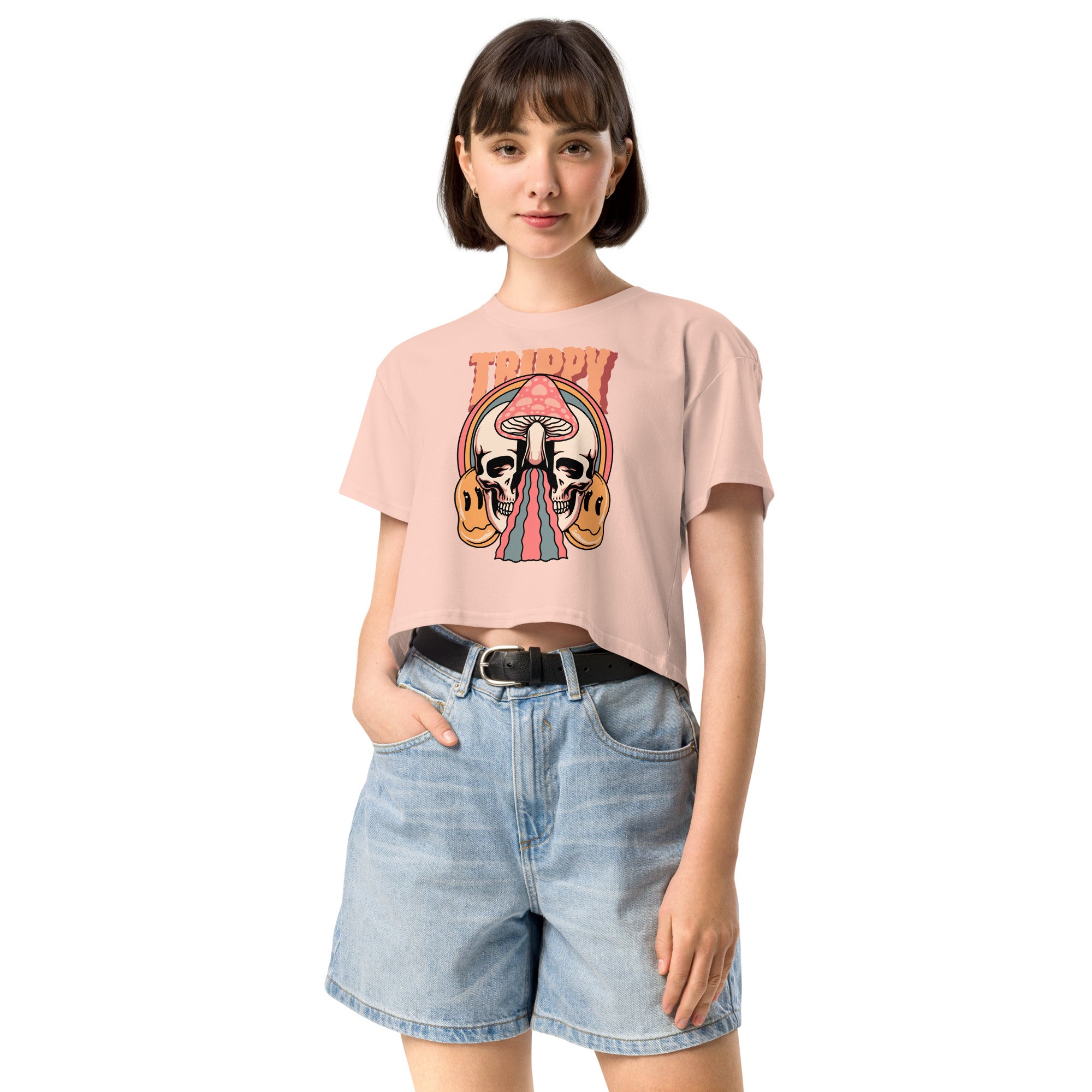 Cropped tee featuring a split skull and mushroom design with melting psychedelic color and smiley faces. Soft combed cotton, eco-friendly inks, playful surreal vibe.