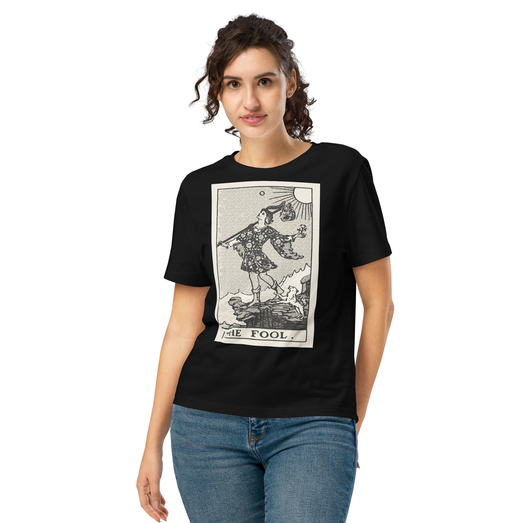 Fitted organic cotton t-shirt featuring The Fool tarot card illustration in high-contrast woodcut rendering.