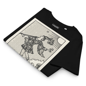 Fitted organic cotton t-shirt featuring The Fool tarot card illustration in high-contrast woodcut rendering.
