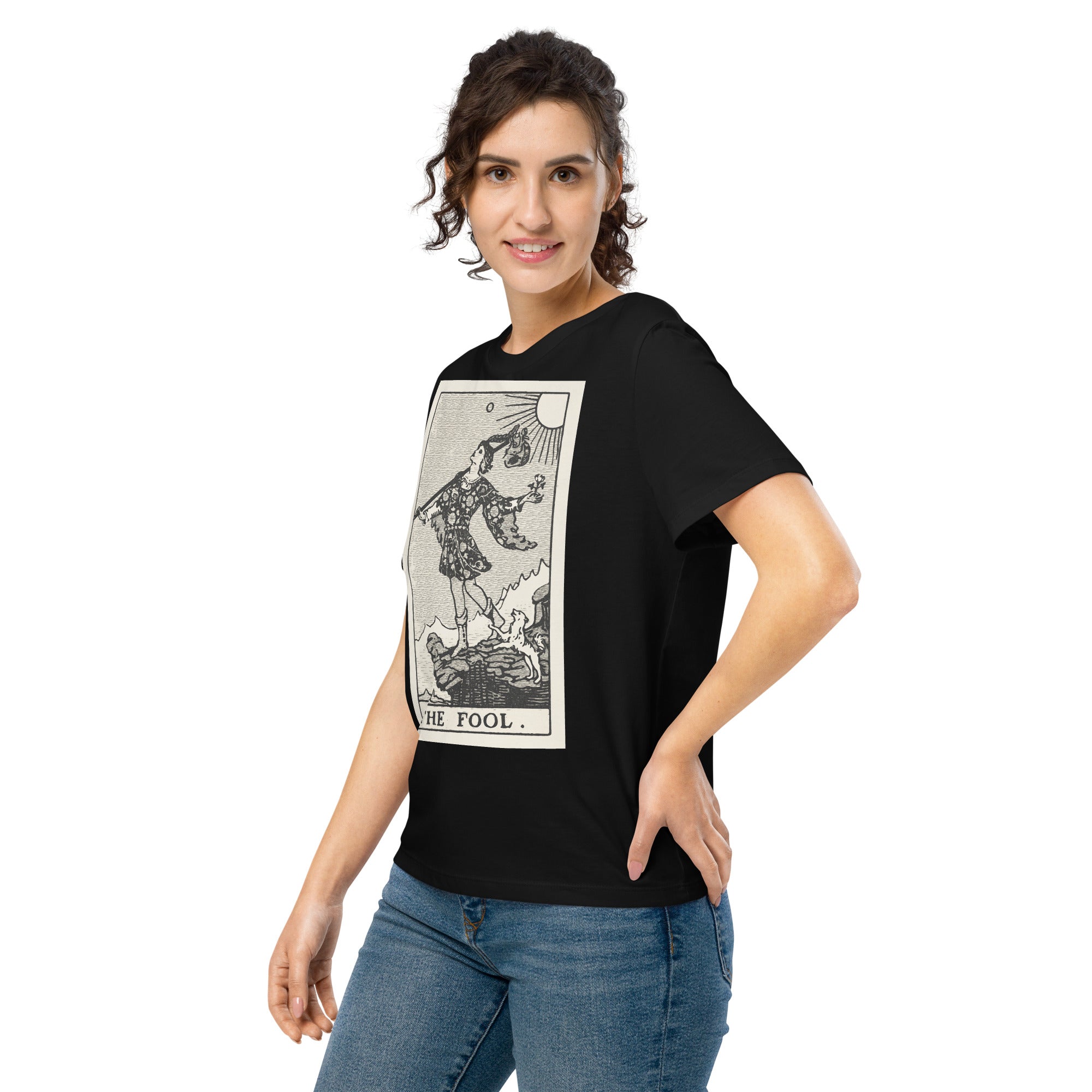 Fitted organic cotton t-shirt featuring The Fool tarot card illustration in high-contrast woodcut rendering.