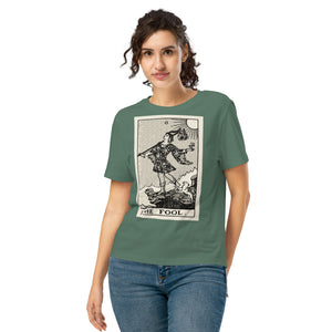 Fitted organic cotton t-shirt featuring The Fool tarot card illustration in high-contrast woodcut rendering.